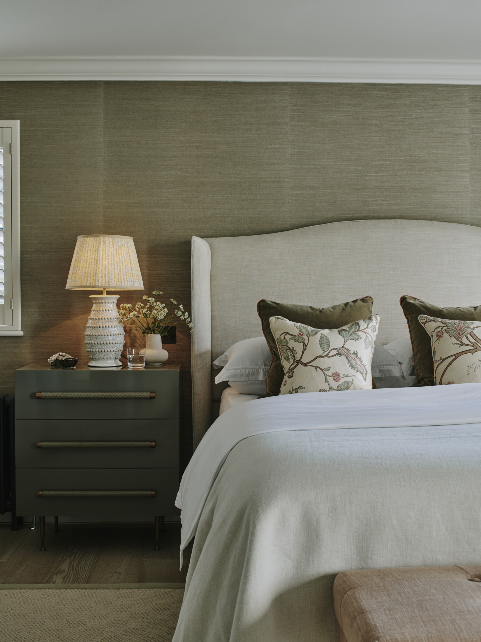 Master bedroom with upholstered headboard