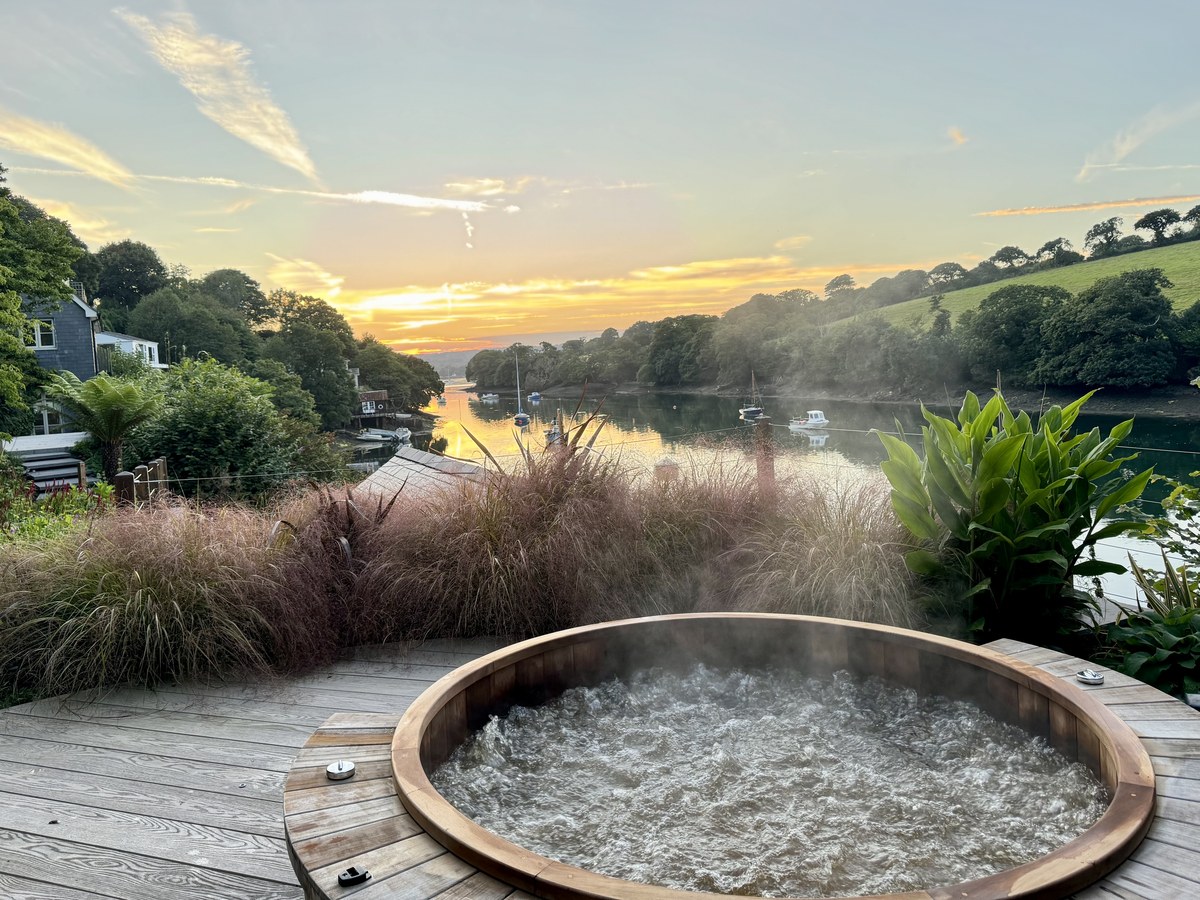 Hot tub at sunset overlooking the Mylor estuary