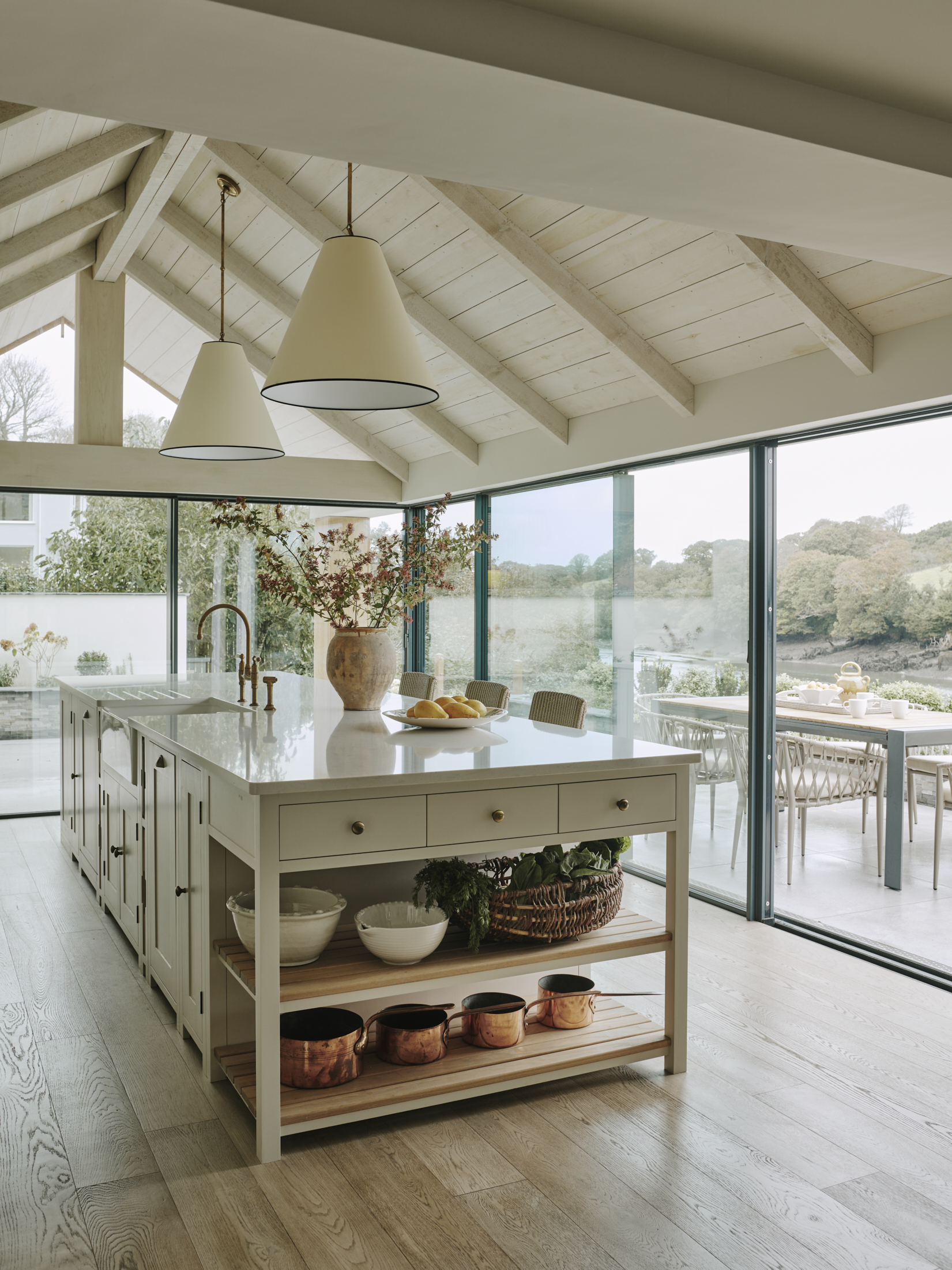 Vaulted kitchen with island and garden views